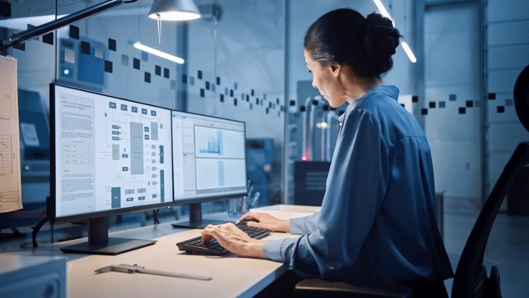 Business analyst working at her computer